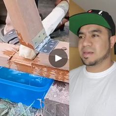 a man in a baseball cap is cutting wood with a large knife and looking at the camera