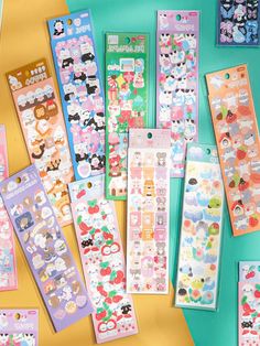 various stickers are laid out on top of each other, including hello kitty and panda