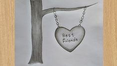 a drawing of a heart hanging from a tree with the words best friends written on it