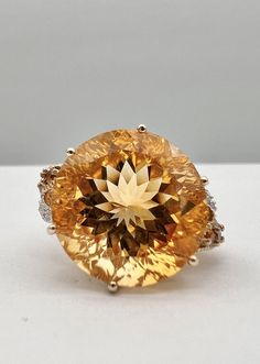 Designer 10k Yellow Gold Natural 13.20ct Citrine & Diamond Floral Ring Ring Size: 8 - Can Be Resized Metal: 10k Yellow Gold - Tested & Hallmarked Weight is 7.1 Grams on my scale  Ring is 17.5mm Wide Amazing Natural 13.20ct Round Fancy Cut Citrine & Diamond Gemstones In Great Condition, Any Questions Please Feel Free to ask Thank you Luxury Orange Topaz Round Ring, Luxury Orange Round Topaz Ring, Luxury Orange Topaz Ring, Engagement Rings Citrine, Jewellery Lookbook, Citrine Engagement Ring, Citrine Ring Engagement, Victorian Engagement Rings, Floral Ring