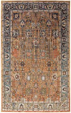 an antique persian rug with blue, orange and green colors on the center area is shown