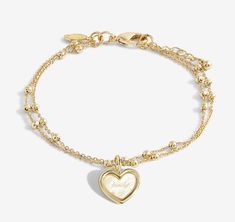 Help your loved ones to celebrate every special milestone with our My Moments Collection. Our 'Always And Forever Family' Bracelet features a gold-plated, dainty chain with a sparkling heart-shaped pendant, wrapped around one of our signature stylized card and framed by a sweet poem. - Our 'A Little' Collection celebrates every one of life's treasured moments - both big and small. With a captivating charm and heartfelt poem for every loved one and occasion. - CARE INSTRUCTIONS Katie Loxton is a Forever Bracelets, Family Bracelet, Katie Loxton, Wishlist Ideas, Family Bracelets, Gold Girl, Jewelry Accessories Ideas, Dope Jewelry, Dainty Chain