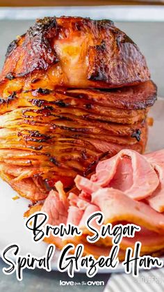 brown sugar spiral glazed ham on a white plate with the words, brown sugar spiral glazed ham