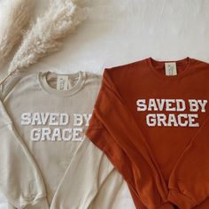 This Saved By Grace Crewneck Sweatshirt is the perfect Religious/Christian sweatshirt to declare your faith! A great for your family, friends, or Christian loved ones. - They need to be purchased individually (it's not sold as a set) - Sweatshirt material is super soft and comfy! ♡ - All our sweatshirts run a UNISEX fit. (Both for men and women). They are naturally oversized, so we normally recommend your true size. But if you like a more baggy look, we recommend sizing up. - These letters are i Cute Christian Tshirt Designs, Christian Tops For Women, Team Jesus Shirts, Trendy Christian Shirts, Christian Christmas Sweatshirt, Youth Group Shirts Design, Love Like Jesus Shirt, Youth Group Outfits, Christian Sweatshirt Designs