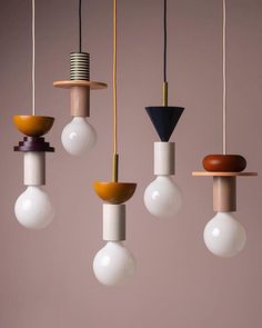 five light bulbs with different shapes hanging from them