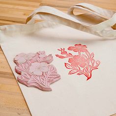 a tote bag sitting on top of a wooden floor