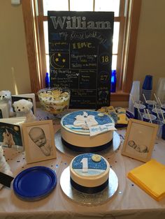 a table topped with pictures and cakes covered in frosting