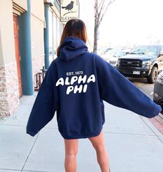 Soft, cute, and trendy, this Alpha Phi hoodie will quickly become your go-to cozy sweatshirt! Use the drop down to specify preference between carolina blue, navy, royal blue, pink, chocolate, or red. LISTING IS FOR ALPHA PHI. Please be sure you are ordering for your correct Sorority.  We print on high quality, soft, & heavyweight materials, sustainably made and printed in the US. ♥ SIZING ♥ Unisex Sizing- For a more feminine, fitted look we recommend getting your size. For a more oversized look, Alpha Alpha, Bubble Font, Sorority Sweatshirts, Alpha Omega, Big Little Gifts, Alpha Sigma Alpha, Alpha Delta Pi, Pink Chocolate, Alpha Phi