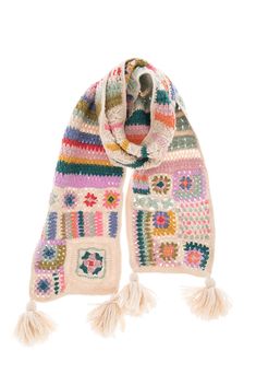 a multicolored knitted scarf with tassels