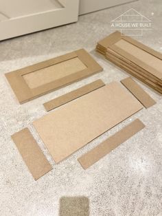 several pieces of cardboard laid out on the floor