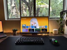 a desktop computer sitting on top of a wooden desk next to a keyboard and mouse