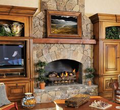 a living room filled with furniture and a fire place in front of a flat screen tv