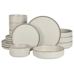 white dinnerware set with silver rims and saucers on a white background for sale