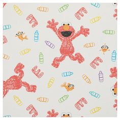 the sesame character is on white fabric with colorful crayons and other cartoon characters