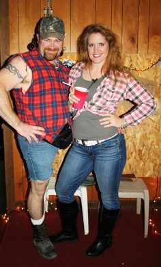 a man and woman are dressed up as lumber characters for halloween party in front of wood paneled walls