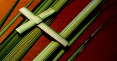 a cross made out of bamboo sticks on a table