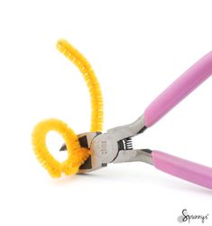 two pairs of scissors with yellow handles and pink handles, on white background for display