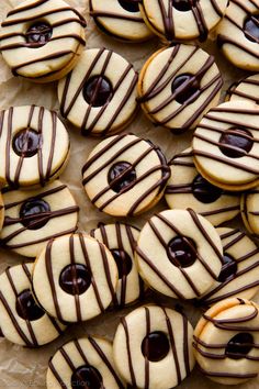 cookies with chocolate drizzled on them are arranged in the shape of hearts