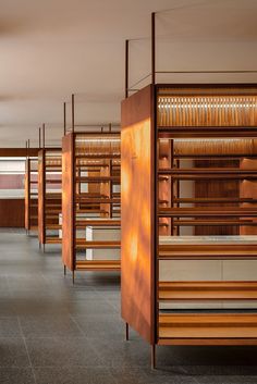 rows of wooden shelves in an empty room