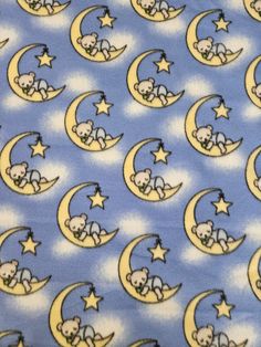 a blue tie with snoopy on the moon and stars in the sky above it