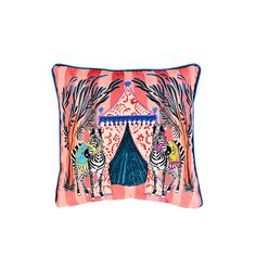 a pink and blue pillow with zebras in front of a circus tent at night