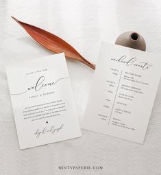 two wedding programs with a leaf on top