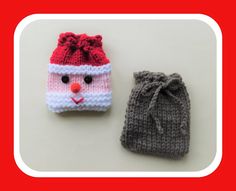 two knitted items are sitting next to each other on a white surface with a red frame