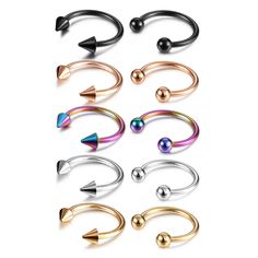 six pairs of piercings with different shapes and colors on them, all in various sizes