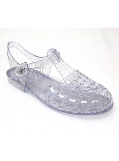 a pair of clear shoes on top of a white surface