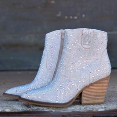 Add Glamour to any party with these "Kady" Silver Rhinestone Booties with allover rhinestone detailing. Pointed Toe Silhouette, side zipper closure, 3" wooden block heel, 5" ankle length from ankle to top of bootie. 8 1/2" total inches tall from sole to top of Bootie. Wedge Boot, Ankle Length, Bootie, Side Zipper, Block Heels, Ankle Boot, Wedges