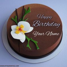 a chocolate birthday cake with white and yellow flowers on it's side that says happy birthday to your name