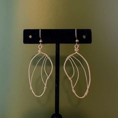 Handmade, light gold wire earrings! Inspired by butterfly wings, these are a perfect gift or pair for personal use. Made to order-- message for special requests (I can make these in silver as well!) Handmade Metal Butterfly Earrings, Handmade Butterfly Metal Earrings, Nickel-free Copper Wire Earrings As Gift, Nickel Free Copper Wire Earrings As A Gift, Gold Wire Dangle Earrings, Wire Wrapped Rose Gold Earrings For Gift, Handmade Gold Wing-shaped Earrings, Gold Wire Earrings For Pierced Ears, Elegant Nickel-free Copper Wire Earrings