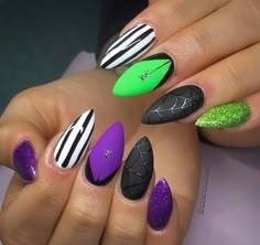 Coffin Nails Designs Halloween, Orange Black Purple Green Halloween Nails, Halloween Nails Green And Purple, Purple And Green Nails Halloween, Pointy Halloween Nails, Green And Purple Halloween Nails, Bright Halloween Nails, Purple And Green Halloween Nails, Almond Halloween Nail Designs