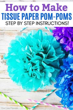 tissue paper pom - poms on a table with straws