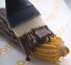 a close up of a chocolate covered pastry