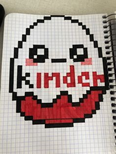 a notebook with an image of a creepy face drawn in red and black on it