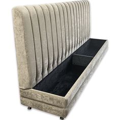 an upholstered bench with black velvet lining and casteors on the bottom shelf