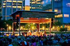 an outdoor concert in the city at night