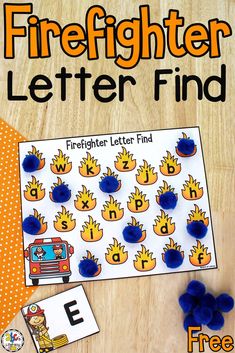 the firefighter letter finder is next to some blue pom poms