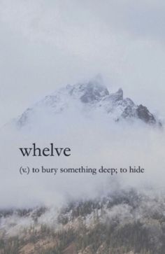 a mountain covered in clouds with the words whelve