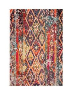 an area rug with multicolored patterns and fringes on the bottom, in various colors