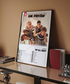 the one direction movie poster is on display