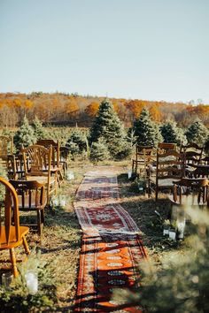 rows of chairs and rugs lined up on the ground