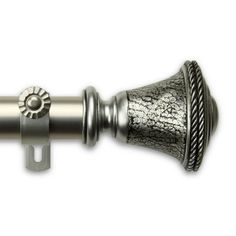 a close up view of a curtain rod with an ornate design on the top and bottom