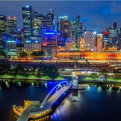 Even walker pedestrian bridge over yarra river and ponyfish island with flinders station and melbourne cbd in background Evan Walker, Recycled Timber Furniture, Walker Evans, Delicious Coffee, Timber Furniture