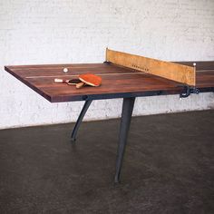 a ping pong table with two paddles on it