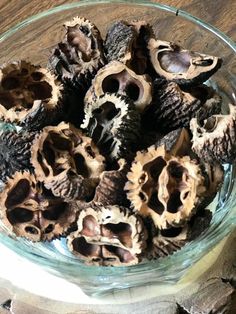 a glass bowl filled with different types of mushrooms