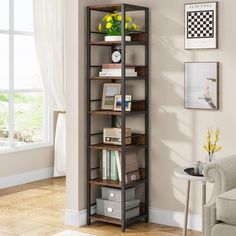 a room with a chair, table and bookshelf