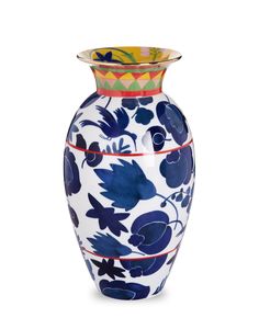 a blue and white vase with flowers painted on it