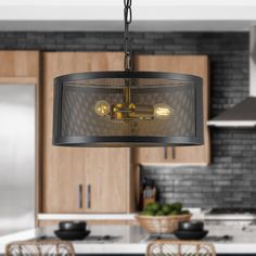 a chandelier hanging from the ceiling in a kitchen